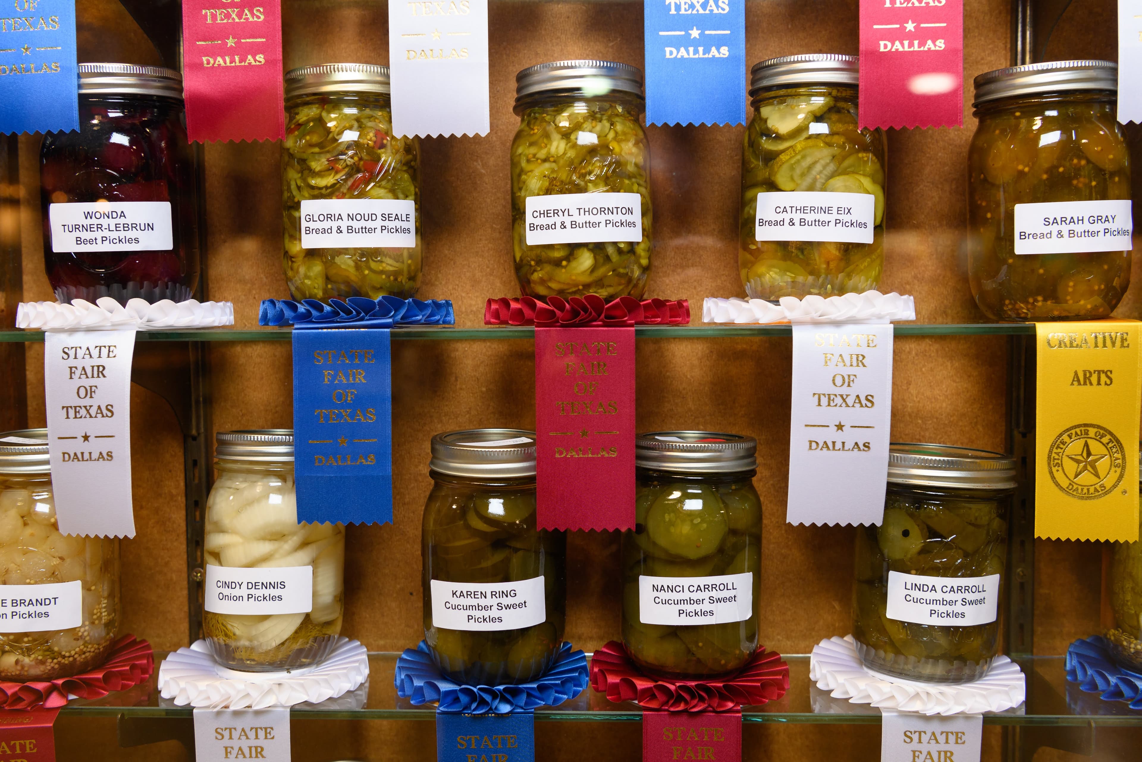 File photo: Preserved-food jars are displayed with State Fair award ribbons. This earlier fair display does not show the 2026 Hall of State exhibits.