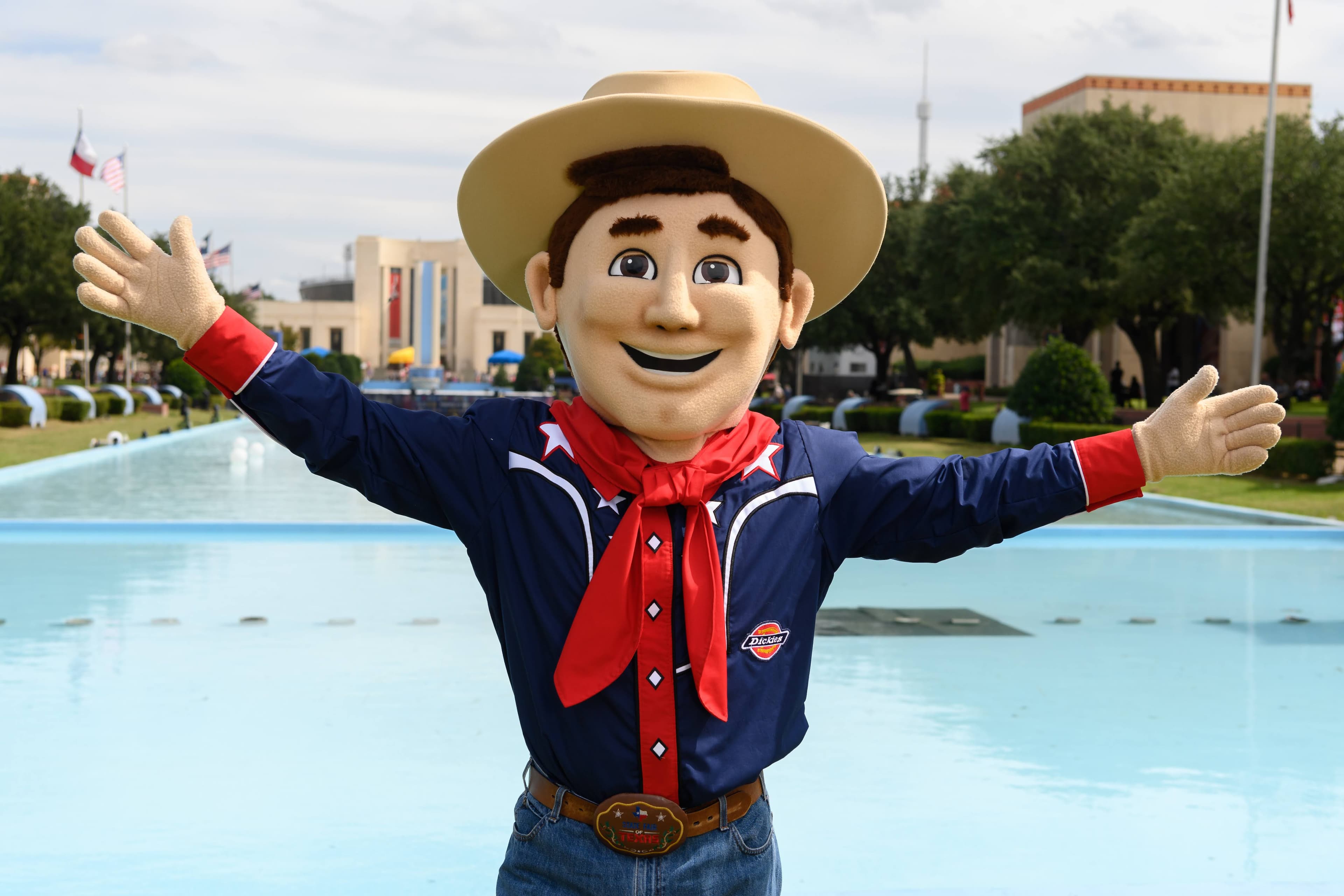 File photo: A cowboy mascot poses beside a reflecting pool.